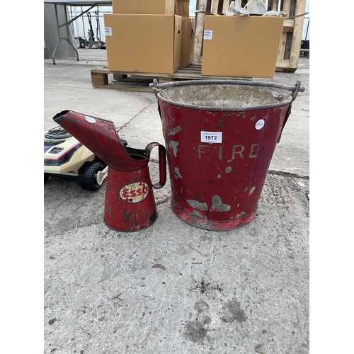 1972 - A VINTAGE FIRE BUCKET AND A VINTAGE ESSO OIL JUG