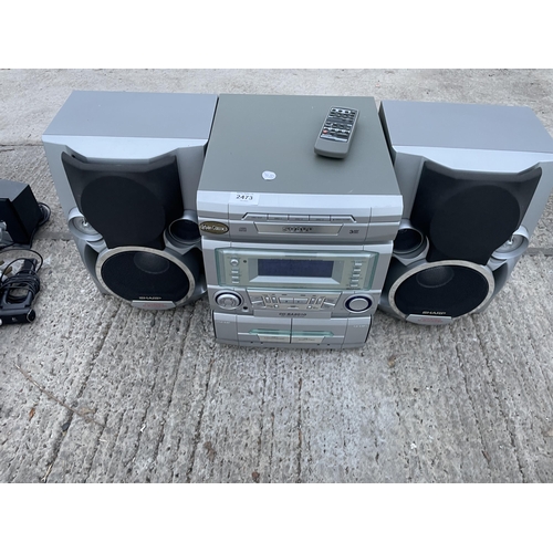 2473 - A SHARP STEREO SYSTEM WITH TWO SPEAKERS