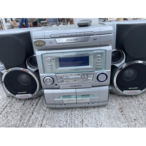 2473 - A SHARP STEREO SYSTEM WITH TWO SPEAKERS