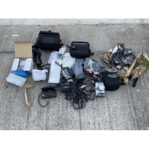 2474 - AN ASSORTMENT OF ITEMS TO INCLUDE A CANON CAMCORDER, DIGITAL CAMERAS AND CABLES ETC