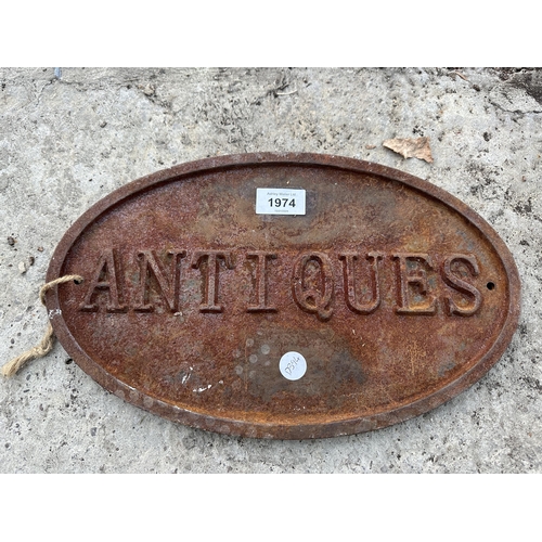 1974 - A VINTAGE CAST 'ANTIQUES' SIGN