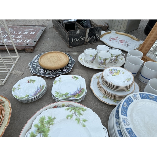 2027 - A LARGE ASSORTMENT OF CERAMICS TO INCLUDE PLATES AND CUPS ETC