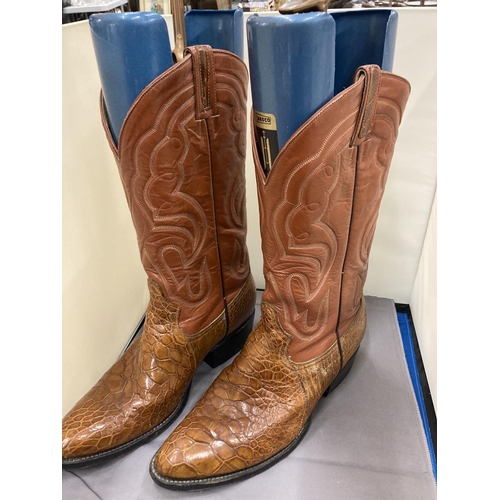 A PAIR OF COWBOY BOOTS WITH INSERTS