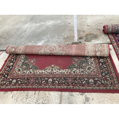 2492 - A LARGE RED PATTERNED RUG