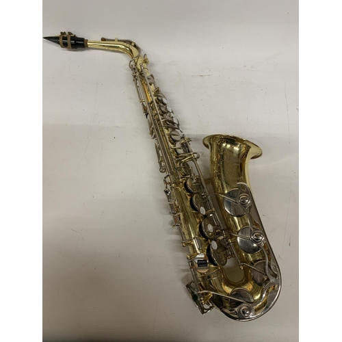 9 - A YAMAHA SAXOPHONE WITH CASE AND A TEACHING BOOK