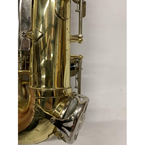 9 - A YAMAHA SAXOPHONE WITH CASE AND A TEACHING BOOK