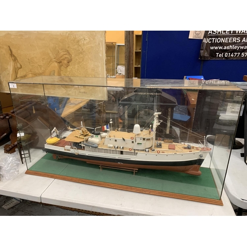 3 - A LARGE MODEL OF A BOAT WITH HELICOPTER IN A GLASS CASE