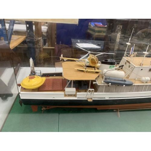 3 - A LARGE MODEL OF A BOAT WITH HELICOPTER IN A GLASS CASE