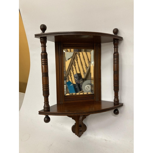 33 - A MAHOGANY EDWARDIAN CORNER MIRROR WITH TWO COLUMS AND SHELF APPROX 18' TALL