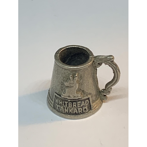 48 - THREE VINTAGE ADVERTISING ITEMS TO INCLUDE A CRAWFORDS BISCUITS BADGE, A WHITBREAD MINIATURE TANKARD... 