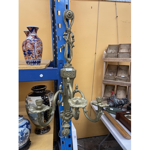 61 - A WALL MOUNTED THREE BRANCH CANDELABRA