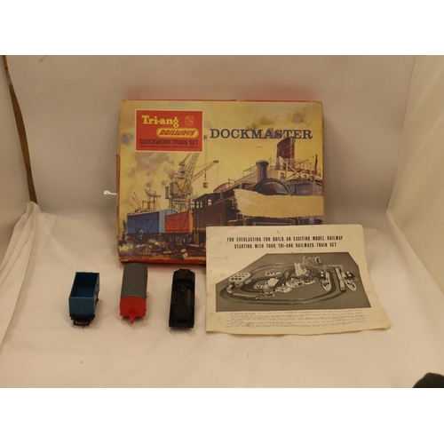 116 - A VINTAGE TRI-ANG DOCKMASTER CLOCKWORK TRAIN SET - BOXED