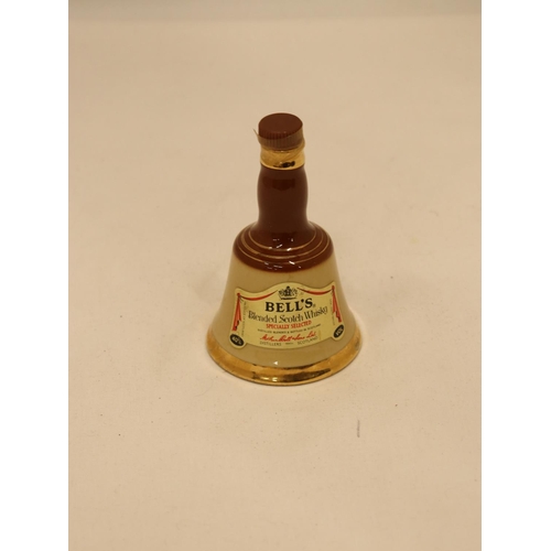 117 - A SMALL FULL BELL'S CERAMIC WHISKY DECANTER, HEIGHT 10CM