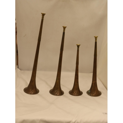 151 - FOUR GRADUATED VICTORIAN BRASS AND COPPER HUNTING HORNS