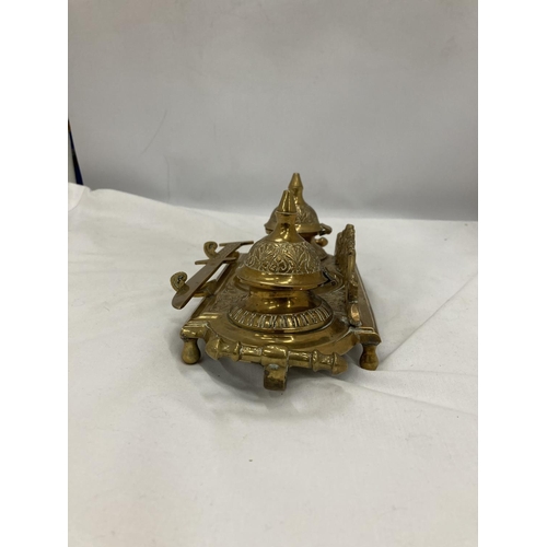 208 - AN ORNATE VINTAGE BRASS INKWELL STAND