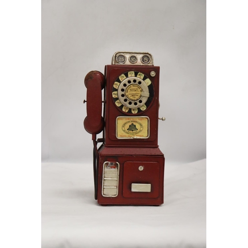 246 - AN UNUSUAL USA VINTAGE TIN PLATE PHONE MONEY BOX, HEIGHT 33CM