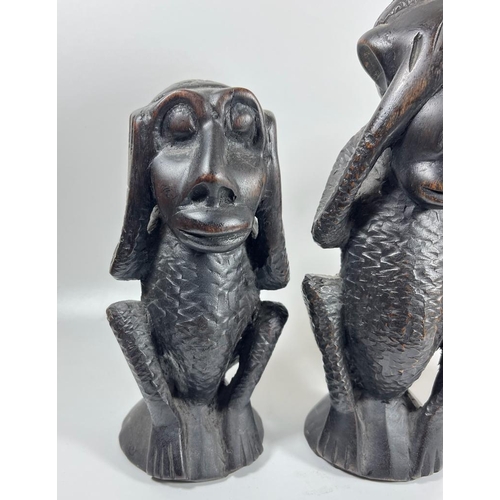 331 - A SET OF THREE AFRICAN TRIBAL CARVED HARDWOOD EBONY EFFECT 'SPEAK NO, HEAR NO, SEE NO EVIL' MONKEYS,... 