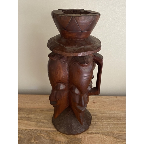 359 - A VINTAGE MID 20TH CENTURY AFRICAN TRIBAL CARVED WOODEN FACE MASK JUG WITH HANDLE AND ASHTRAY DESIGN... 