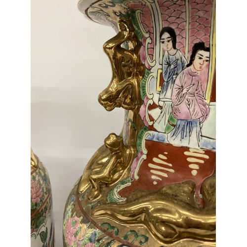 388 - A LARGE PAIR OF CHINESE FAJMILLE ROSE VASES WITH LIZARD MOULDED NECK AND LION HANDLES