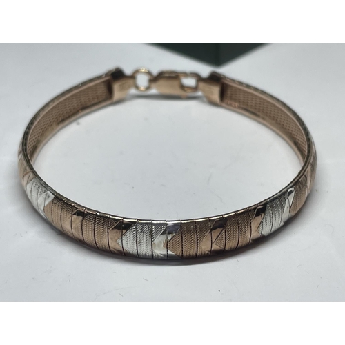 544 - A BOXED SILVER TRI COLOUR BANGLE