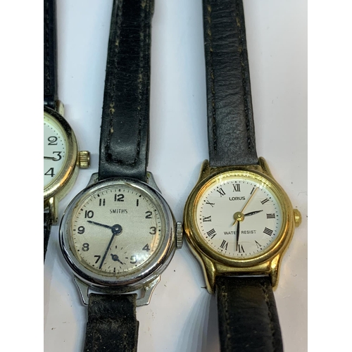 619 - FOUR LADIES WATCHES ON LEATHER STRAPS TO INCLUDE A VINTAGE SMITHS WATCH, LORUS, REFLEX, ETC