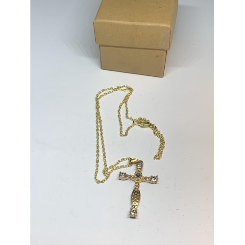 655 - A NECKLACE WITH A CRYSTAL CROSS PENDANT IN A PRESENTATION BOX