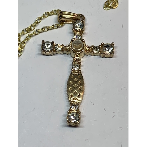 655 - A NECKLACE WITH A CRYSTAL CROSS PENDANT IN A PRESENTATION BOX