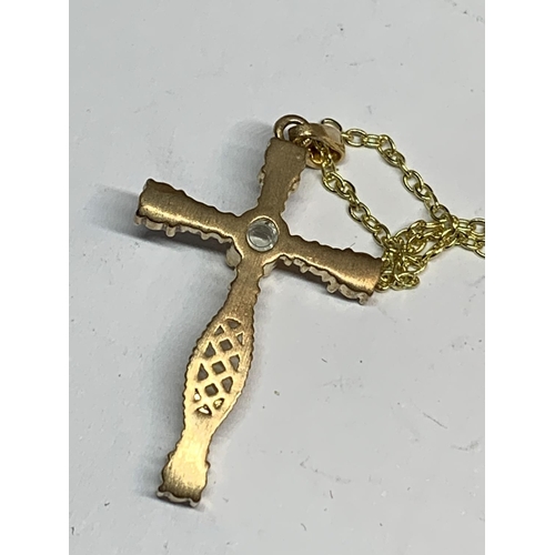 655 - A NECKLACE WITH A CRYSTAL CROSS PENDANT IN A PRESENTATION BOX