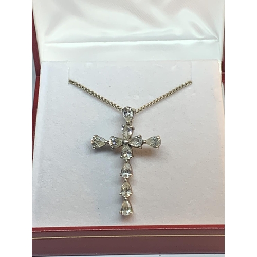 678 - A SILVER AND CLEARSTONE CRUCIFIX NECKLACE IN A PRESENTATION BOX