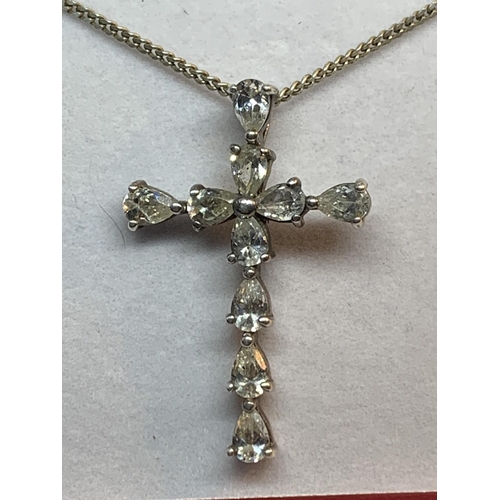 678 - A SILVER AND CLEARSTONE CRUCIFIX NECKLACE IN A PRESENTATION BOX