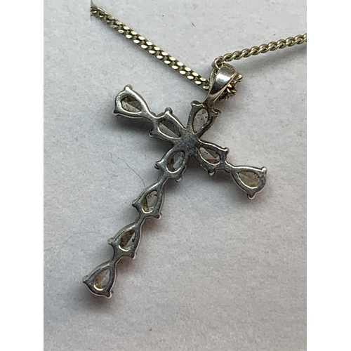 678 - A SILVER AND CLEARSTONE CRUCIFIX NECKLACE IN A PRESENTATION BOX