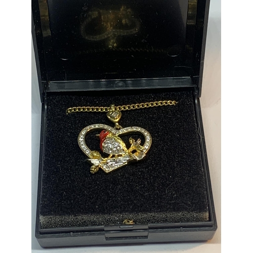 691 - A NECKLACE WITH A CRYSTAL ROBIN PENDANT IN A PRESENTATION BOX