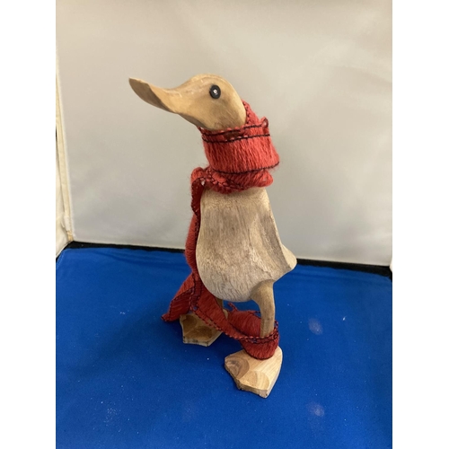 805 - A CARVED WOODEN DUCK WEARING A SCARF, HEIGHT 22CM