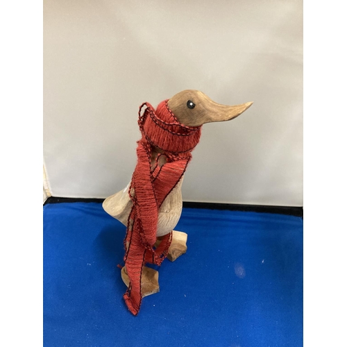 805 - A CARVED WOODEN DUCK WEARING A SCARF, HEIGHT 22CM