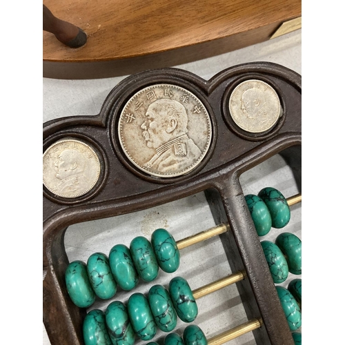 876 - A CHINESE ABACUS WITH MALACHITE COUNTERS AND SILVER COINS