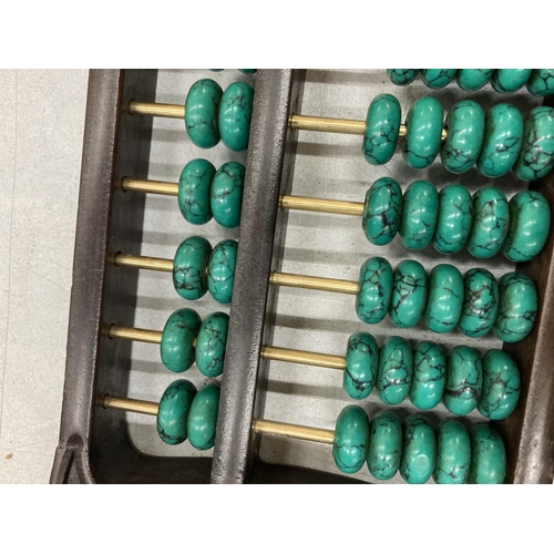 876 - A CHINESE ABACUS WITH MALACHITE COUNTERS AND SILVER COINS