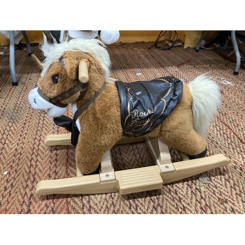 915A - A SMALL CHILD'S PLUSH ROCKING PONY