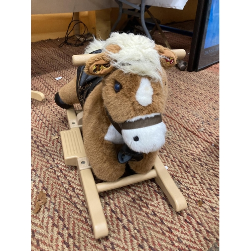 915A - A SMALL CHILD'S PLUSH ROCKING PONY