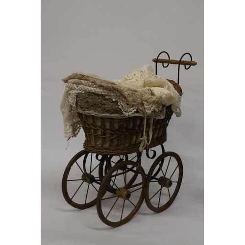 919 - A VICTORIAN CHILD'S PRAM WITH LACE COVERS