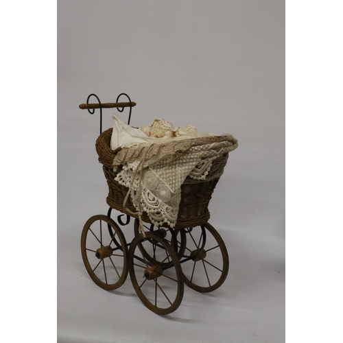 919 - A VICTORIAN CHILD'S PRAM WITH LACE COVERS