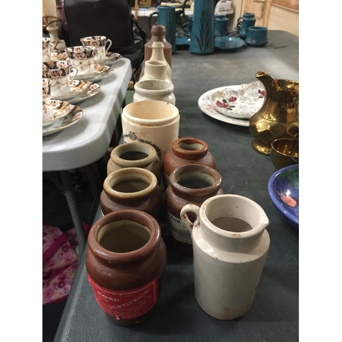 995 - A GROUP OF VINTAGE STONEWARE JARS AND BOTTLES, SOME WITH NEWER LABELS