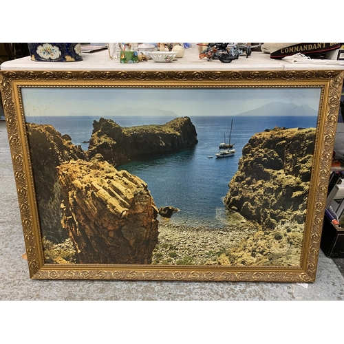 1039 - A LARGE FRAMED PRINT OF BOATS NEAR A BEACH