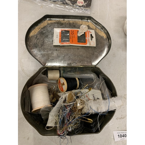 1040 - A VINTAGE TIN CONTAINING SEWING ITEMS