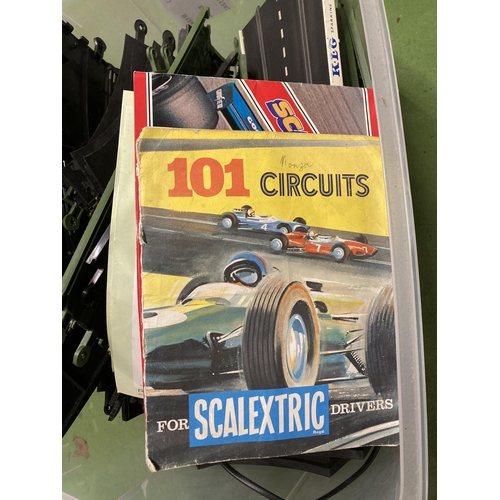 1073 - A SCALEXTRIC TRACK TOGETHER WITH BOOKLETS AND POWERPACK