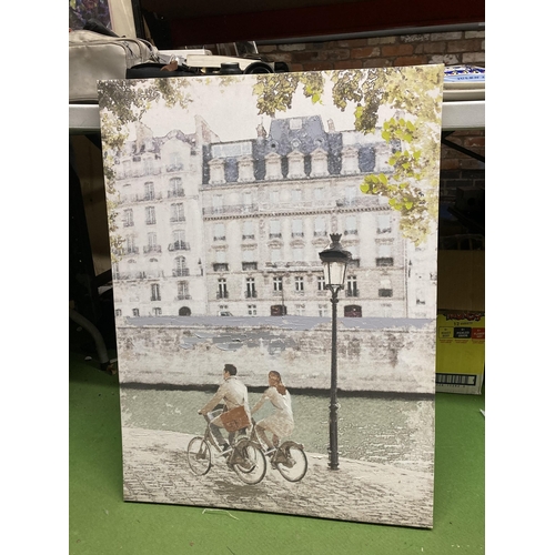 1077 - TWO CANVAS PRINTS, A PARISIEN SCENE AND AMSTERDAM CANAL SCENE