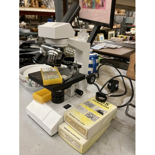 1115 - A MODERN ELECTRIC MICROSCOPE WITH SLIDES SEEN WORKING BUT NO WARRANTY