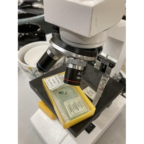 1115 - A MODERN ELECTRIC MICROSCOPE WITH SLIDES SEEN WORKING BUT NO WARRANTY