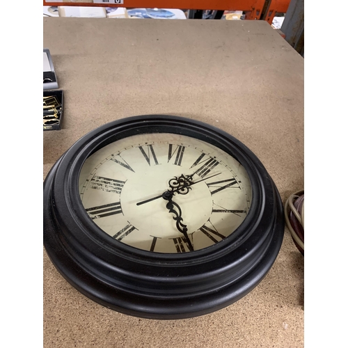 1130 - A MODERN STYLE CLOCK WITH ROMAN NUMERALS