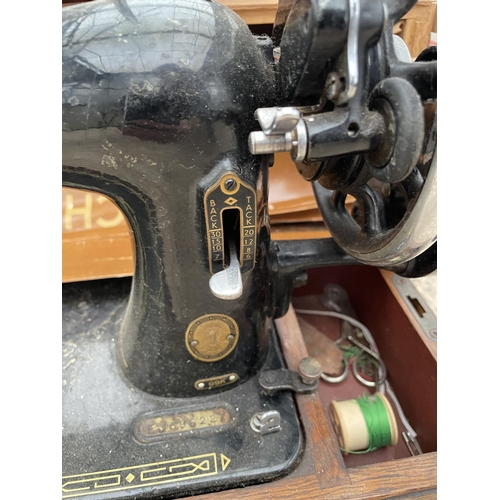 1679 - A VINTAGE SINGER SEWING MACHINE WITH A CARRY CASE