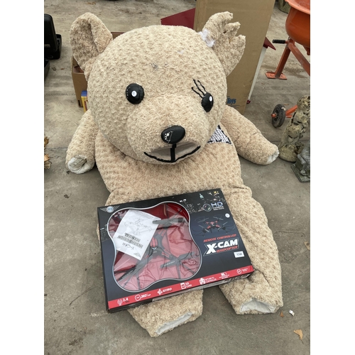 1745 - TWO ITEMS TO INCLUDE A LARGE SOFT TEDDY BEAR COSTUME AND A REMOTE CONTROLLED X-CAM QUADCOPTER